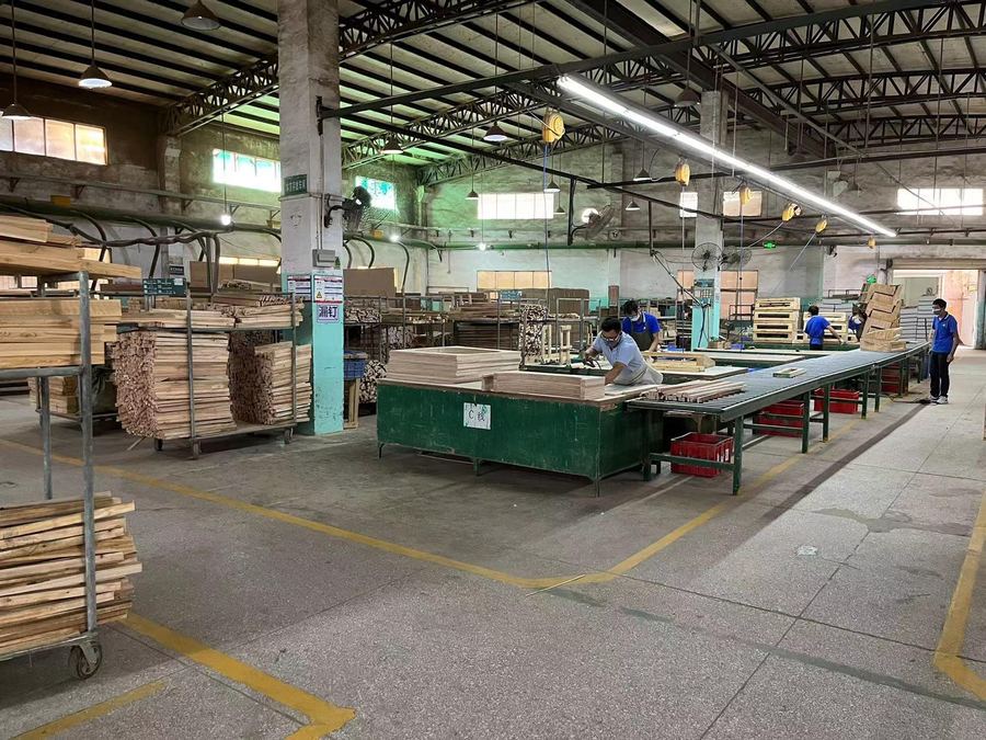 The wood shop, with frame parts stacked on carts